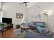 Cozy living room with vaulted ceiling, neutral colors, wood floors, and comfortable seating at 258 W Sabal Palm Pl # 22, Longwood, FL 32779