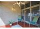 Relaxing outdoor patio with ceiling fan, comfortable seating, and charming decor for pleasant lounging at 258 W Sabal Palm Pl # 22, Longwood, FL 32779