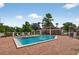Community pool area with lounge chairs, a covered pavilion, and a well-maintained brick surround at 258 W Sabal Palm Pl # 22, Longwood, FL 32779