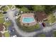 Aerial view of the community pool with ample parking and well-maintained landscaping at 258 W Sabal Palm Pl # 22, Longwood, FL 32779