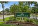 Sabal Place community sign with lush landscaping, pond, and fountain, creating a welcoming entrance at 258 W Sabal Palm Pl # 22, Longwood, FL 32779