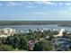 Scenic view from condo overlooking the intercostal waterway, marina, and lush greenery on a clear day at 265 Minorca Beach Way # 902, New Smyrna Beach, FL 32169