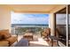 Enjoy the scenic view from this spacious outdoor balcony with comfortable lounge seating at 265 Minorca Beach Way # 902, New Smyrna Beach, FL 32169