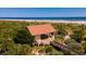 An aerial view of a private beach access point with a gazebo and scenic ocean views at 265 Minorca Beach Way # 902, New Smyrna Beach, FL 32169