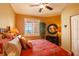 Cozy bedroom featuring a window with shades and a decorative indoor plant at 265 Minorca Beach Way # 902, New Smyrna Beach, FL 32169