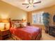 Comfortable bedroom boasting a large window with blinds and decorative furnishings at 265 Minorca Beach Way # 902, New Smyrna Beach, FL 32169