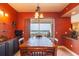 Inviting dining area with a wood table, seating for six, and access to the balcony with beautiful views at 265 Minorca Beach Way # 902, New Smyrna Beach, FL 32169