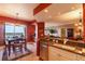 Open concept featuring a dining area with water views, granite countertop, stainless dishwasher and fixtures at 265 Minorca Beach Way # 902, New Smyrna Beach, FL 32169
