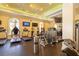 Well-equipped gym with various exercise machines and TVs for an engaging workout experience at 265 Minorca Beach Way # 902, New Smyrna Beach, FL 32169