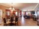 Open-concept living space featuring tile floors, neutral decor, and ample natural light and an adjacent dining area at 265 Minorca Beach Way # 902, New Smyrna Beach, FL 32169