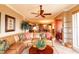 Open-concept living space with tropical decor, an adjacent dining area, and an abundance of natural light at 265 Minorca Beach Way # 902, New Smyrna Beach, FL 32169