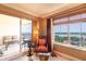 Cozy corner with comfortable seating and access to a private balcony offering scenic views of the water at 265 Minorca Beach Way # 902, New Smyrna Beach, FL 32169
