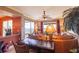 Cozy living room featuring a leather sofa, desk, and a large window with picturesque outdoor views at 265 Minorca Beach Way # 902, New Smyrna Beach, FL 32169