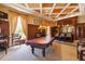 A recreation room showcasing a pool table and a bar area that offers plenty of room for entertainment at 265 Minorca Beach Way # 902, New Smyrna Beach, FL 32169
