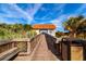 Picturesque wooden boardwalk with a covered area leading to beach at 265 Minorca Beach Way # 902, New Smyrna Beach, FL 32169