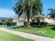 Charming single-story home featuring a manicured lawn, a two-car garage, and beautiful landscaping at 2672 Star Coral Ln, New Smyrna Beach, FL 32168