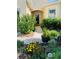 Inviting front entrance with a well manicured garden, enhancing curb appeal at 2672 Star Coral Ln, New Smyrna Beach, FL 32168