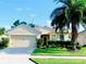 Charming single-story home with a lush front yard and a well-maintained lawn at 2672 Star Coral Ln, New Smyrna Beach, FL 32168