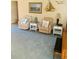 Comfortable living room with recliners, nautical decor, and natural light at 2672 Star Coral Ln, New Smyrna Beach, FL 32168