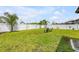 Backyard with new green sod and white vinyl fence at 2731 Neverland Dr, New Smyrna Beach, FL 32168