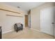 Bedroom featuring neutral walls, natural light, chair, and carpet at 2731 Neverland Dr, New Smyrna Beach, FL 32168