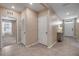 Bright hallway features ceramic tile and neutral paint offering warm welcome into the home at 2731 Neverland Dr, New Smyrna Beach, FL 32168