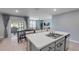 Bright, open kitchen with a view of the dining area and living room, featuring stainless steel appliances at 2731 Neverland Dr, New Smyrna Beach, FL 32168