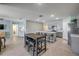 Open concept home with a kitchen, dining area, and living room with tile flooring and neutral paint at 2731 Neverland Dr, New Smyrna Beach, FL 32168