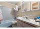 Bathroom featuring shower and tub combination, neutral walls, vanity and mirror at 2901 N Halifax Ave # 215, Daytona Beach, FL 32118