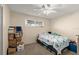 Bedroom with natural light from window, ceiling fan, and boxes at 2901 N Halifax Ave # 215, Daytona Beach, FL 32118
