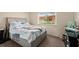 Bedroom with a comfortable bed, window view, and dresser, providing a relaxing atmosphere at 2901 N Halifax Ave # 215, Daytona Beach, FL 32118