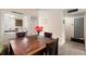 Cozy dining area features wooden table, seating for four, with view into the kitchen at 2901 N Halifax Ave # 215, Daytona Beach, FL 32118