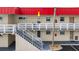 Condo with exterior stairs leading to a cozy, private balcony that overlooks the community at 2901 N Halifax Ave # 215, Daytona Beach, FL 32118