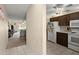 Bright kitchen with tile flooring adjacent to the living area is perfect for entertaining at 2901 N Halifax Ave # 215, Daytona Beach, FL 32118