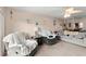 Comfortable living room with relaxing seating arrangements and calming decor, illuminated by a ceiling fan at 2901 N Halifax Ave # 215, Daytona Beach, FL 32118
