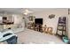 Open living room with comfortable seating, TV, ceiling fan and carpeted floors at 2901 N Halifax Ave # 215, Daytona Beach, FL 32118