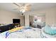 Bright main bedroom with ceiling fan, TV, comfortable bed, and mirrored closet at 2901 N Halifax Ave # 215, Daytona Beach, FL 32118