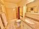 Bathroom features a shower-tub combo, granite countertop, and tile flooring at 2918 Mango Tree Dr, Edgewater, FL 32141