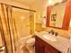 Bathroom features a shower-tub combo, granite countertop, and tile flooring at 2918 Mango Tree Dr, Edgewater, FL 32141