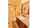 Bathroom features a shower-tub combo, granite countertop, and tile flooring at 2918 Mango Tree Dr, Edgewater, FL 32141