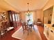 Elegant dining room showcasing a chandelier, formal dining set, and abundant natural light at 2918 Mango Tree Dr, Edgewater, FL 32141