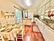 Charming kitchen with white cabinetry, granite countertops, and adjacent breakfast nook at 2918 Mango Tree Dr, Edgewater, FL 32141