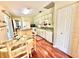 Charming kitchen with white cabinetry, granite countertops, and adjacent breakfast nook at 2918 Mango Tree Dr, Edgewater, FL 32141