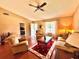 Comfortable living room with bright lighting, wood floors, and plush seating arrangements at 2918 Mango Tree Dr, Edgewater, FL 32141