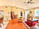 Inviting living room featuring cozy armchairs, wood floors, and a bright, airy atmosphere at 2918 Mango Tree Dr, Edgewater, FL 32141