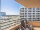 Condo balcony with chairs offering expansive city views at 3023 S Atlantic Ave # 8010, Daytona Beach, FL 32118