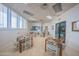 Common room featuring tables and chairs, an exit door, and great lighting at 3023 S Atlantic Ave # 8010, Daytona Beach, FL 32118