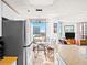 Bright dining area with city views, a ceiling fan, and modern decor at 3023 S Atlantic Ave # 8010, Daytona Beach, FL 32118