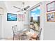 Charming dining area with city views, a glass table, and comfortable seating at 3023 S Atlantic Ave # 8010, Daytona Beach, FL 32118