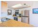 Bright kitchen with stainless steel appliances, granite countertops, and wood cabinets at 3023 S Atlantic Ave # 8010, Daytona Beach, FL 32118